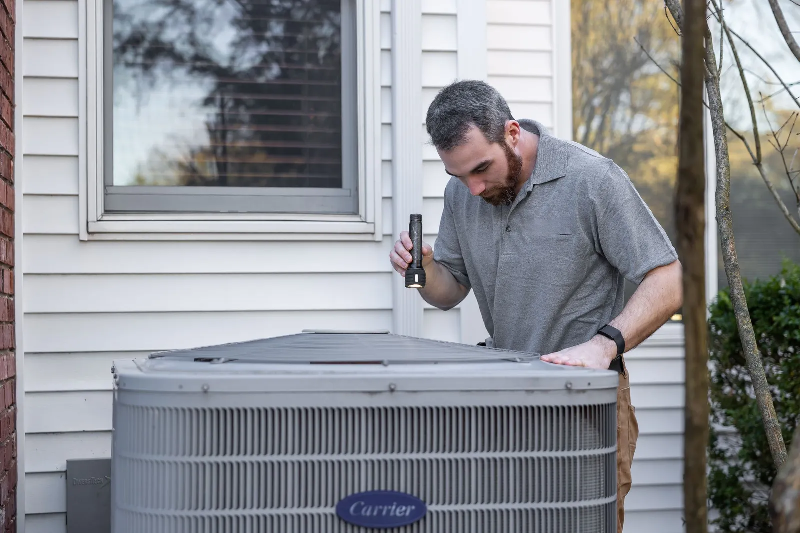 Maintenance technician inspecting building mechanical equipment